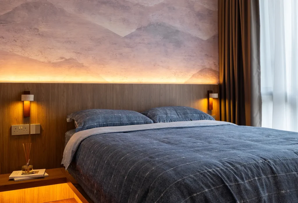 opt for a simple wooden bed frame paired with crisp bedding. keep the decor minimal, layer in natural textiles, and use warm, soft lighting to create a relaxing atmosphere.